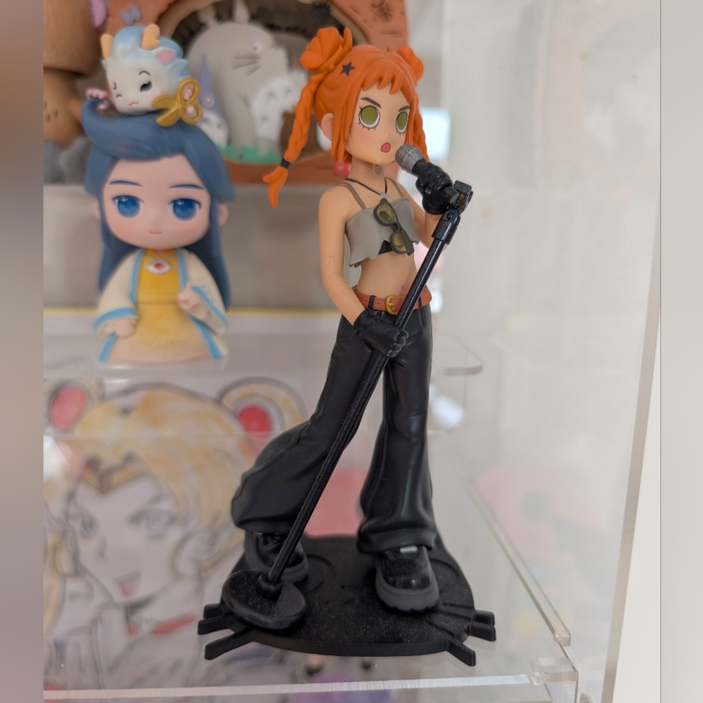 Gigi: The Singer from the POP MART Peach Riot Rise Up Series.